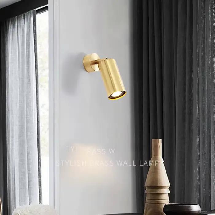 Applique murale LED réglable en laiton doré